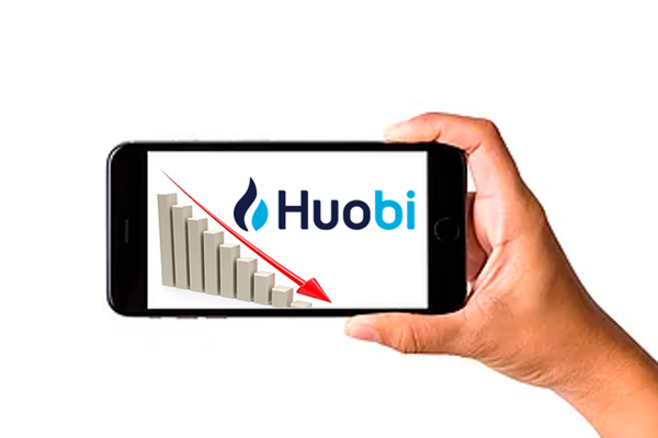 A phone with the Huobi logo and graph on the screen.